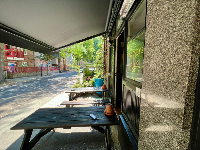 The Harrison pub has outdoor tables that are heated and covered